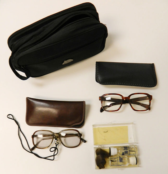 Various CIA spy technology items including glasses, cases, and a small black pouch showcasing innovative spy gear designs.
