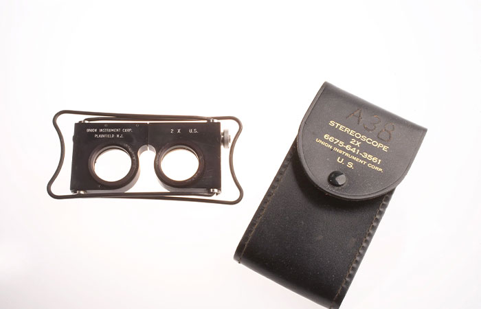 Vintage CIA spy technology stereoscope device with black leather case showcasing advanced optical ingenuity.