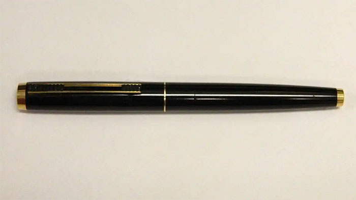 Black pen with gold accents, an example of CIA spy technology demonstrating human ingenuity in covert devices.