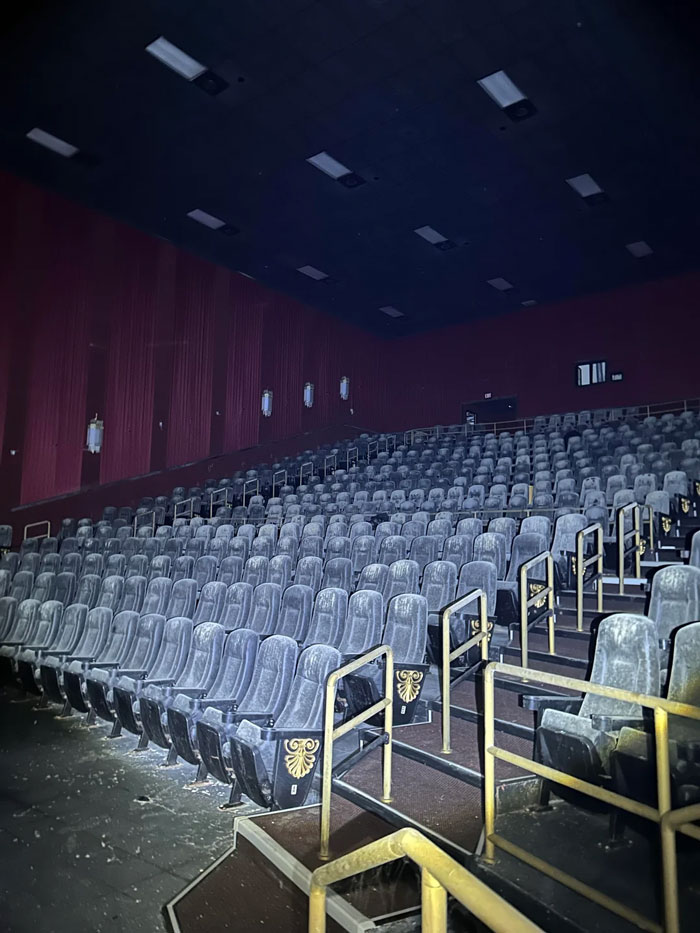 Empty old movie theater seats covered in dust and debris, a creepy scene that people had to share online.