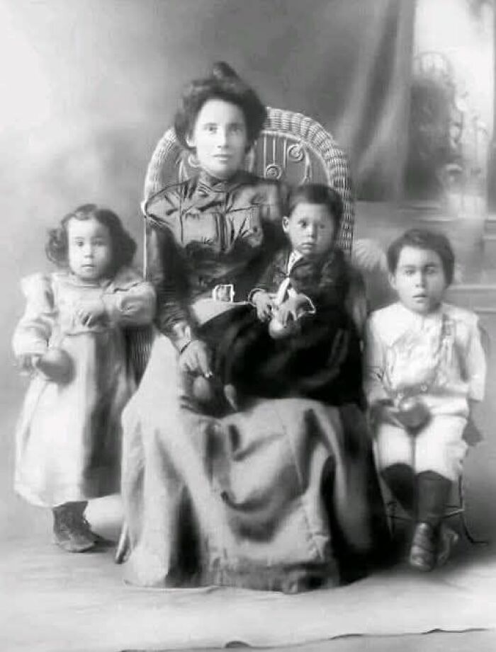 Vintage black and white portrait of a woman and children illustrating unusual wonderful or tragic historical facts