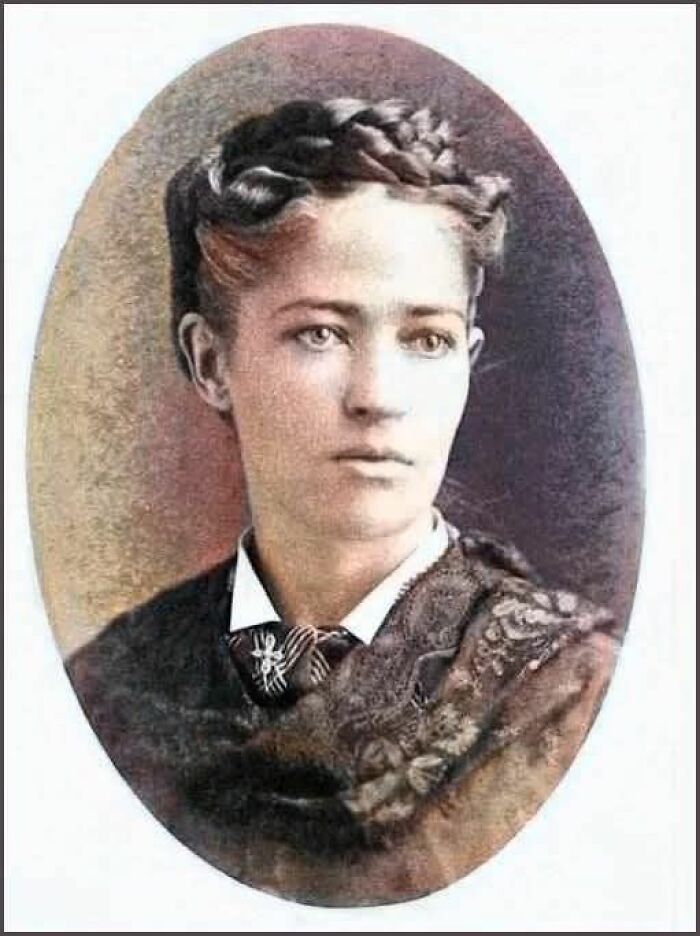 Vintage portrait of a young woman with braided hair and Victorian attire representing unusual historical facts.