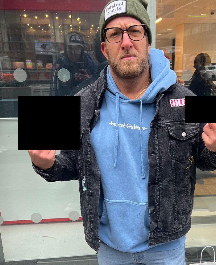 Dave Portnoy in casual attire outdoors, wearing glasses and a beanie, symbolizing Dave Portnoy net worth exposure.