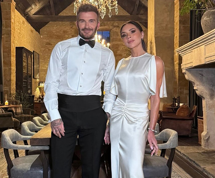 David and Victoria Beckham dressed elegantly at an indoor event, as Brooklyn Beckham's ex breaks silence on Beckham family.