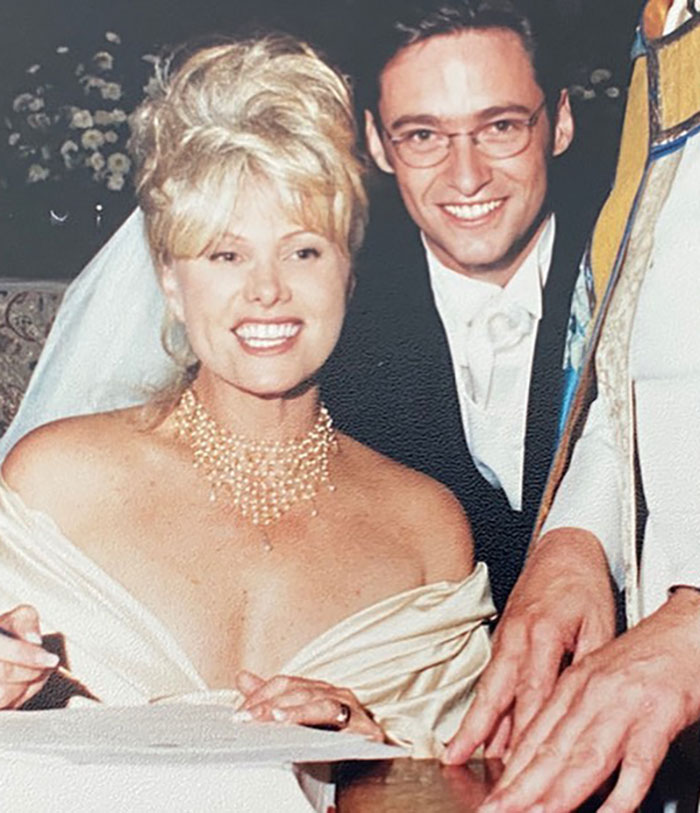 Deborra-Lee Furness and groom smiling at wedding, highlighting journey of betrayal and divorce filing from Hugh Jackman.