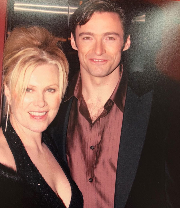 Deborra-Lee Furness and Hugh Jackman posing together at an event, related to journey of betrayal and divorce news.