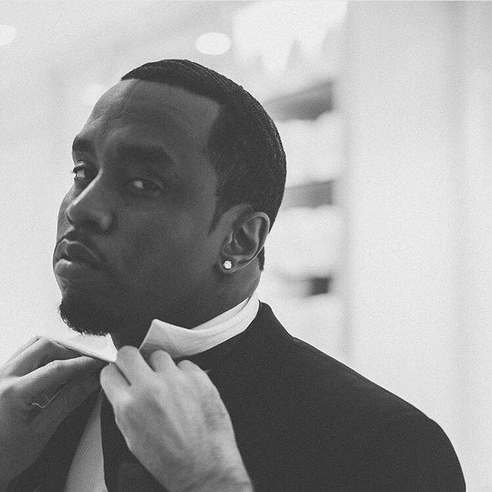 Black and white photo of a man adjusting his tie, related to Justin Bieber and Diddy victim trial rumors. Black and white photo of a man adjusting his tie, related to Justin Bieber and Diddy victim trial rumors.