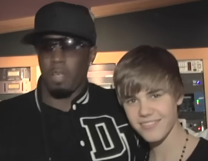 Two men posing together in a recording studio, highlighting Justin Bieber and Diddy amid trial rumors discussion. Two men posing together in a recording studio, highlighting Justin Bieber and Diddy amid trial rumors discussion.