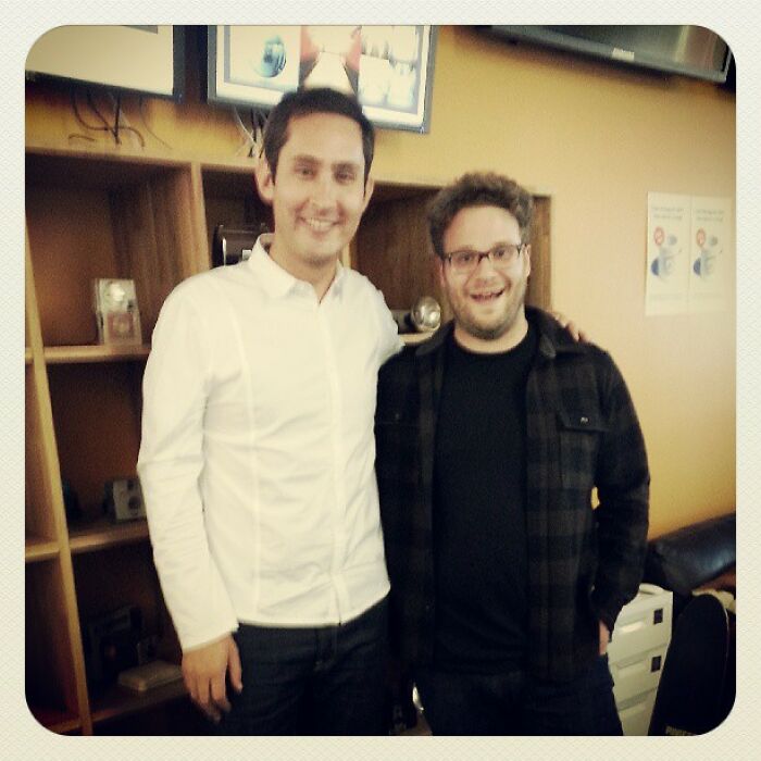 Two men smiling and posing together indoors, featured in a nostalgic Instagram posts celebrities shared long ago.