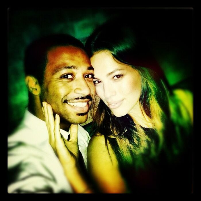 Close-up of two celebrities smiling together in a low-lit setting, sharing a nostalgic Instagram moment.