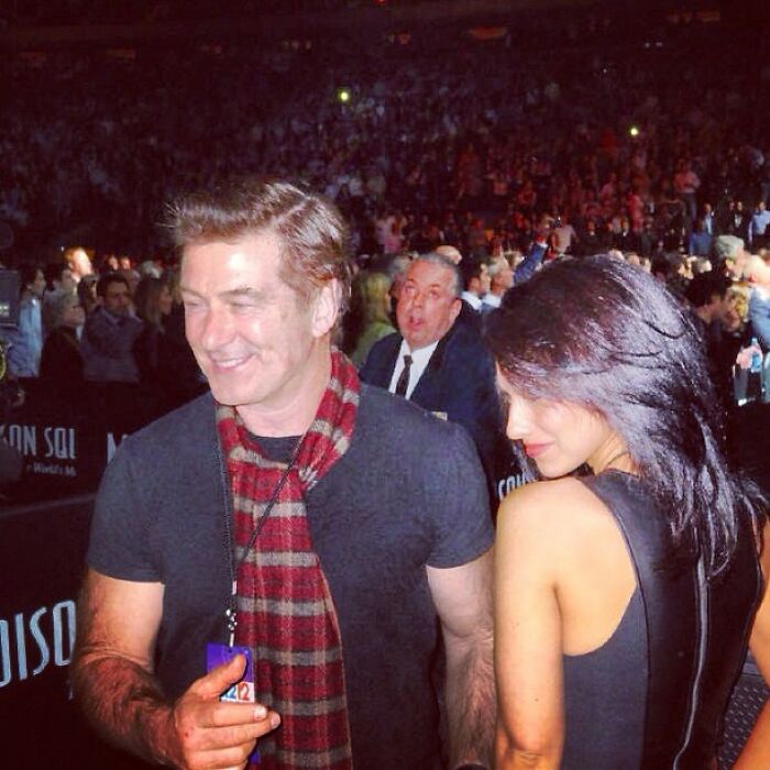 Two celebrities smiling and interacting at a crowded event, capturing a nostalgic Instagram posts moment.