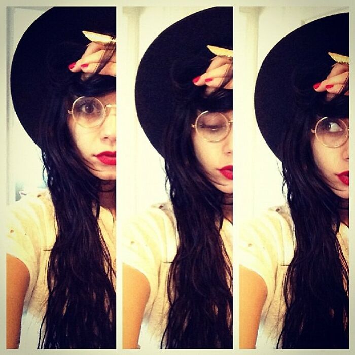 Young woman wearing glasses and a black hat in a vintage style selfie, one of the Instagram posts celebrities shared way back in the day.