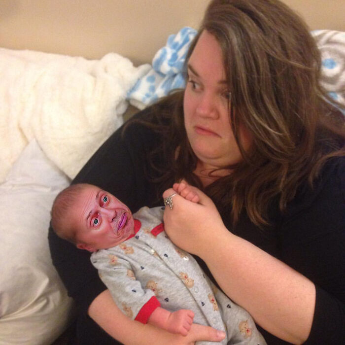 Woman holding baby with an edited humorous face, showcasing hilarious Photoshop skills and creative digital editing.