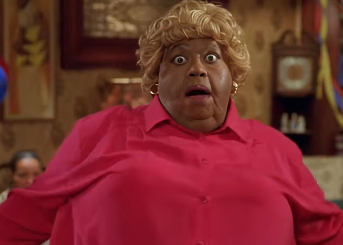 Person in a red shirt with a shocked expression, illustrating parents' reactions to the worst things their kids did in public.