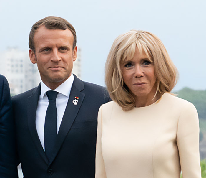 Emmanuel and Brigitte Macron at an event, linked to grooming rumors and teacher-student past controversies. Emmanuel and Brigitte Macron at an event, linked to grooming rumors and teacher-student past controversies.