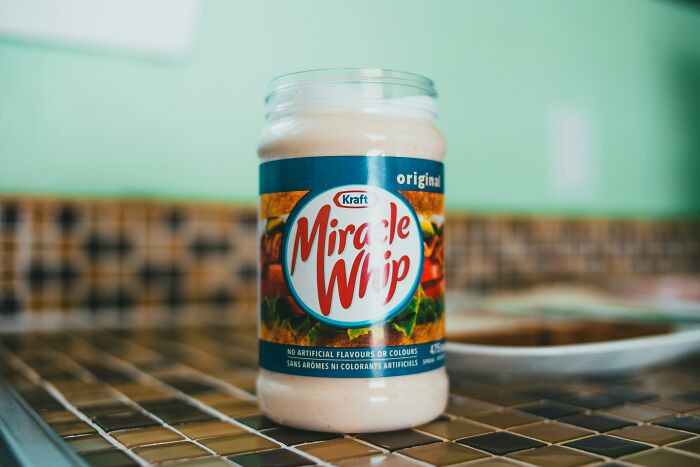 Jar of Kraft Miracle Whip on a kitchen counter, illustrating wild cooking opinions and internet food debates.