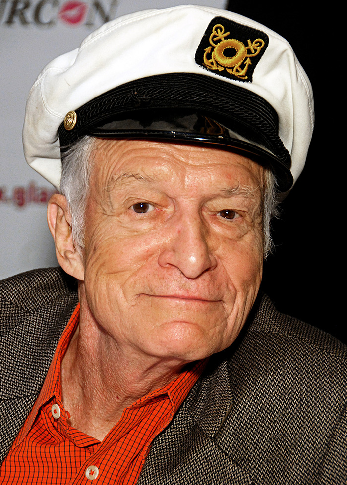 Older man wearing a captain's hat and checkered blazer, related to Playboy Bunnies confessing about intimacy with Hugh Hefner. Older man wearing a captain's hat and checkered blazer, related to Playboy Bunnies confessing about intimacy with Hugh Hefner.