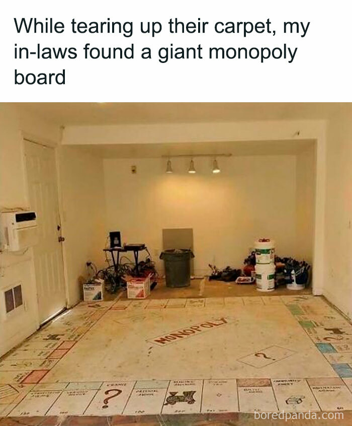 Large monopoly board found underneath carpet during home renovation, highlighting unique and interesting discoveries inside.