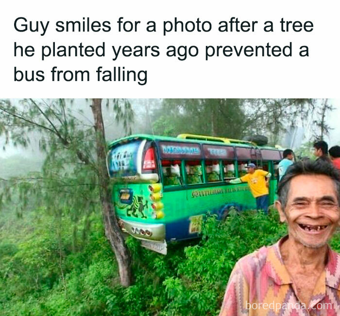 Man smiles next to tree that prevented bus from falling, illustrating an interesting inside look at Big Ben.
