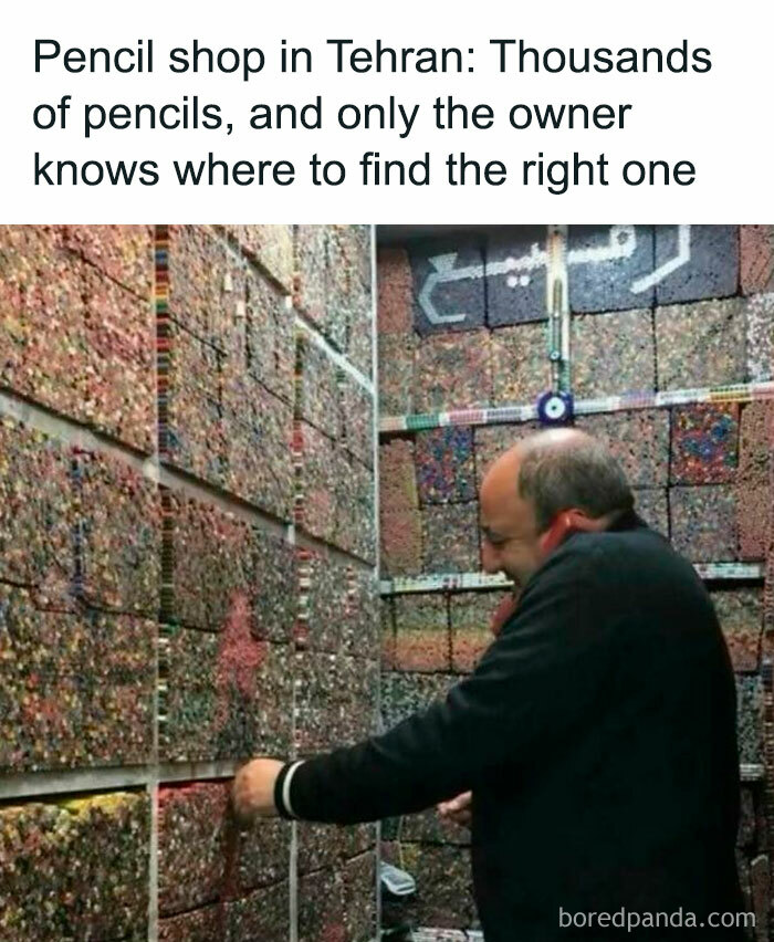 Man in a pencil shop with thousands of pencils, showcasing the inside of Big Ben's intriguing detail and complexity.