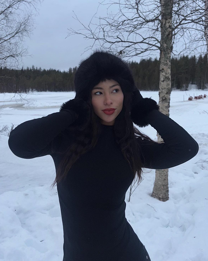 Young woman in black winter outfit standing in snowy forest, related to heartbreaking final texts of tourist abducted coma. Young woman in black winter outfit standing in snowy forest, related to heartbreaking final texts of tourist abducted coma.