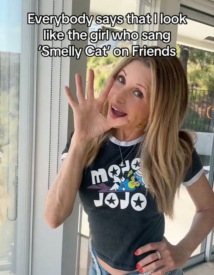 63-year-old Friends star who sang Smelly Cat showing a youthful glow and smiling indoors near a window.