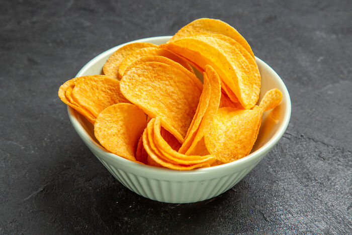 Bowl of potato chips on a dark surface illustrating weird ways people earned quick money.