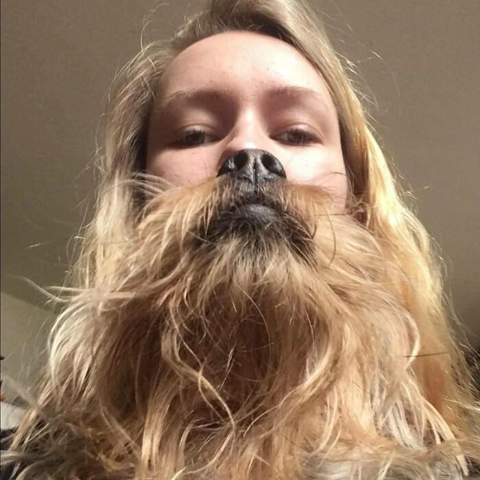 Person with long hair and a dog nose creating a weird pics or it didn’t happen moment for social media.