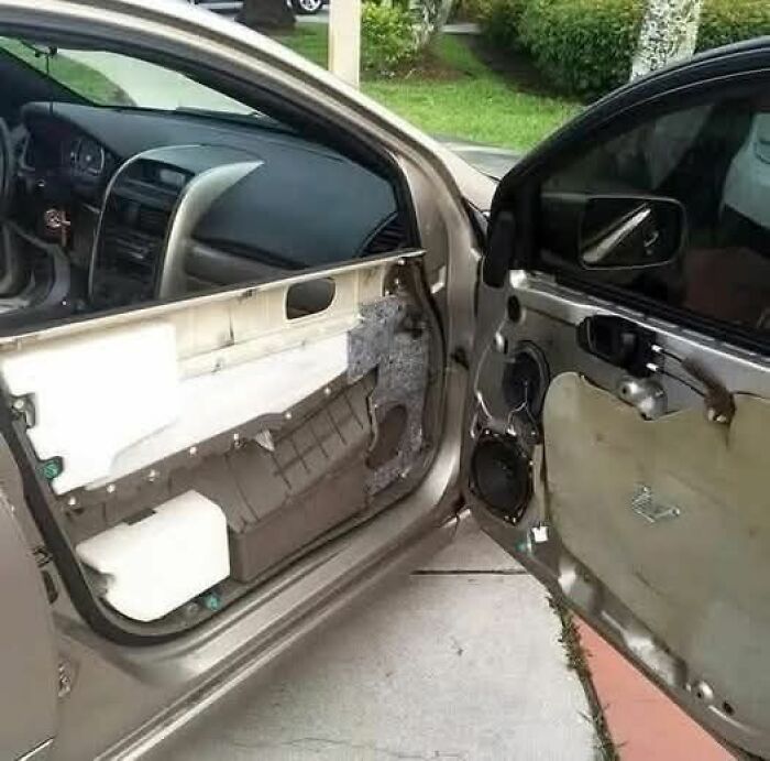 Car door panels removed on both sides showing interior mechanics in a weird pics or it didn’t happen moment.