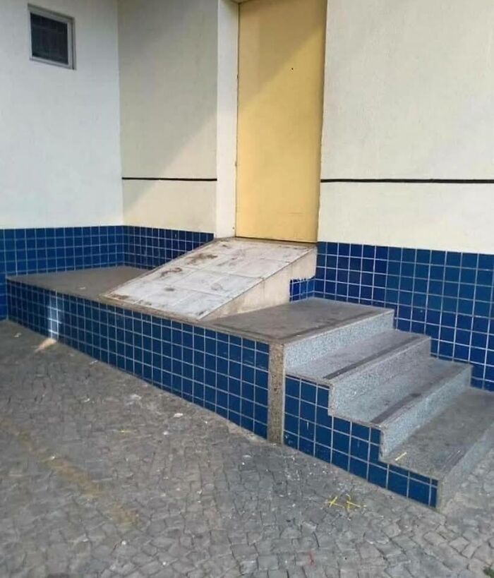 Awkward ramp design next to stairs leading to a door in a weird pics or it didn’t happen moment.