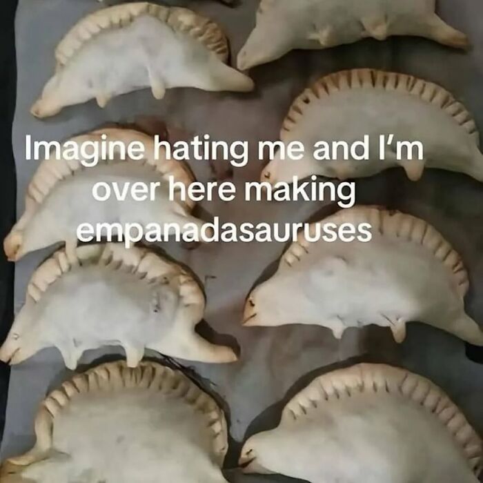 Empanadas shaped like dinosaurs on a tray, providing a fun serotonin boost from this IG page’s daily pics.