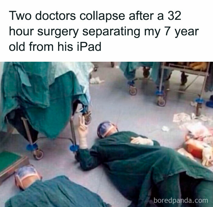 Two doctors in scrubs lie exhausted on floor, humorously illustrating funny parenting memes about separating child from iPad.