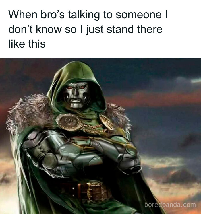 Metal-armored figure with a green hood standing with arms crossed, representing chaotic memes for when life is boring.