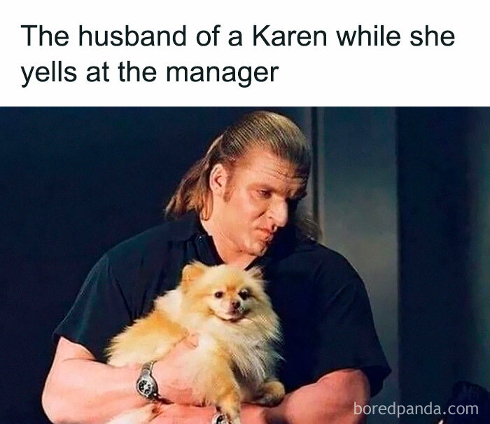Man holding a fluffy dog with a calm expression, humorously representing a Karen husband during a manager confrontation meme.