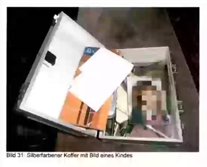 Silver suitcase containing photo and documents related to Madeleine McCann case, under German police investigation.