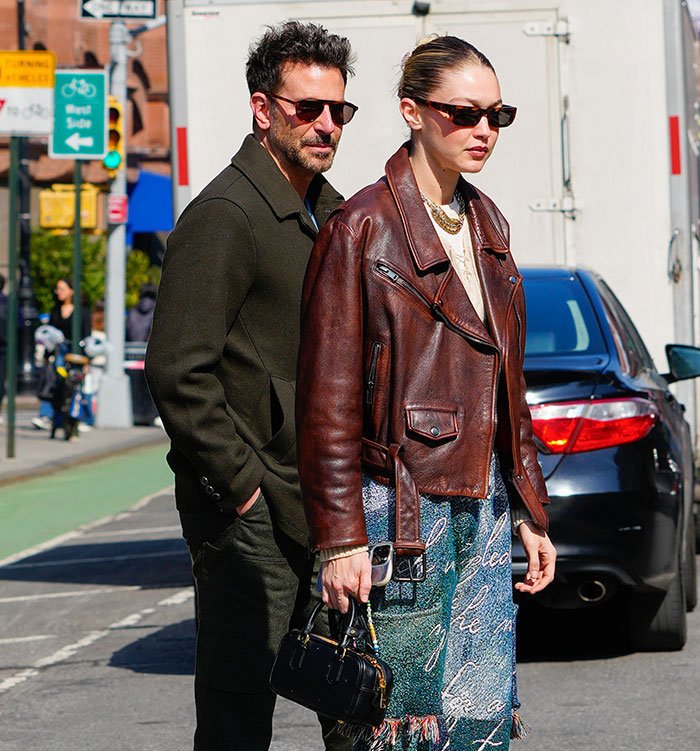 Gigi Hadid and Bradley Cooper walking together in casual outfits, highlighting their relationship and age gap discussions. Gigi Hadid and Bradley Cooper walking together in casual outfits, highlighting their relationship and age gap discussions.