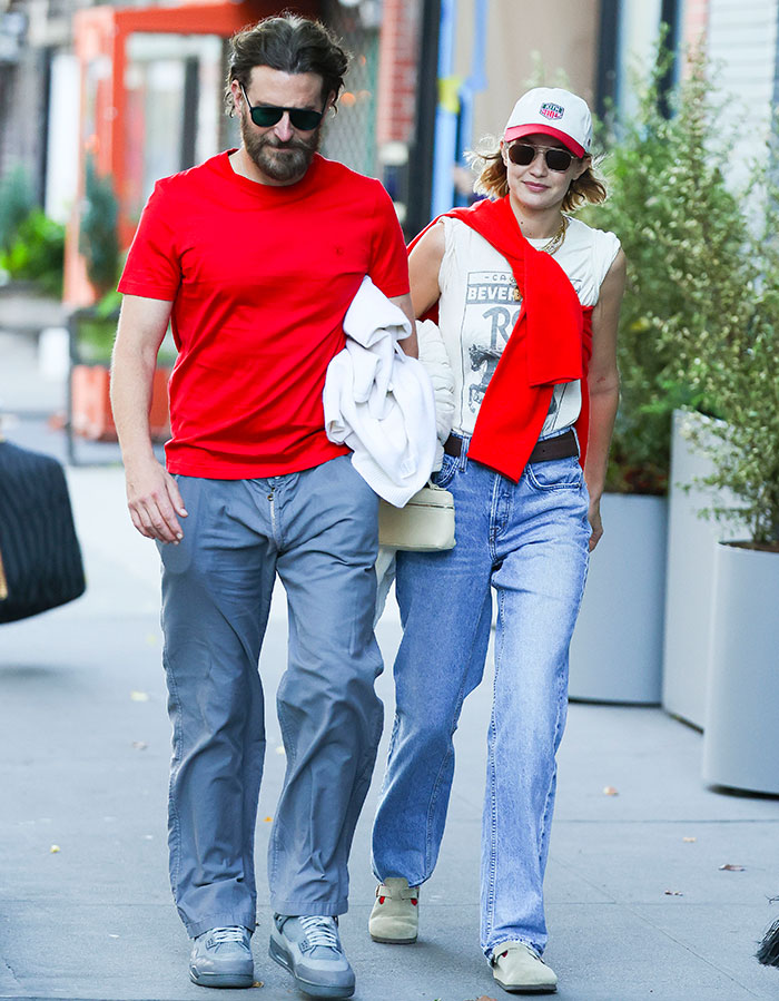 Gigi Hadid and Bradley Cooper walking together outdoors amid fan reactions to their major age gap. Gigi Hadid and Bradley Cooper walking together outdoors amid fan reactions to their major age gap.