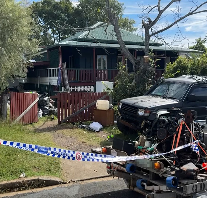 Police tape blocks access to a house and a black vehicle during the investigation of a missing teen case. Police tape blocks access to a house and a black vehicle during the investigation of a missing teen case.