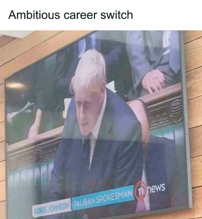 TV screen showing Boris Johnson in a suit with a humorous caption mislabeling him as Taliban spokesman, British memes humor.