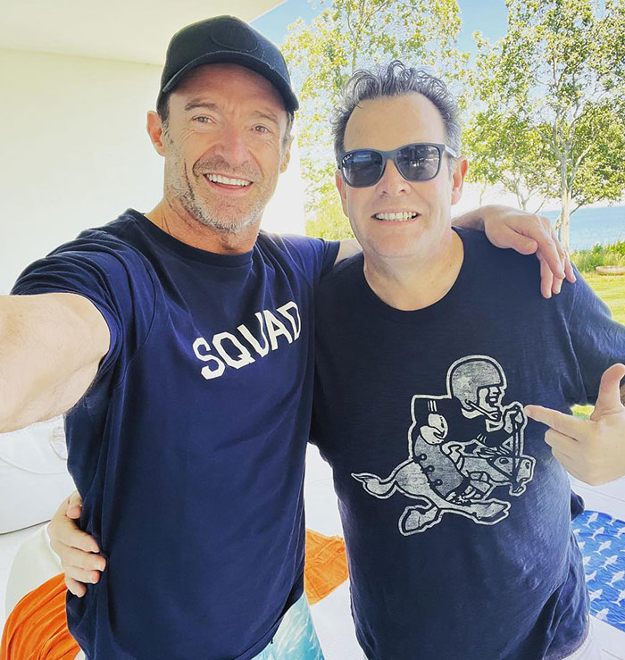 Hugh Jackman with his childhood friend outdoors, both smiling and posing for a casual selfie, news on actor's divorce. Hugh Jackman with his childhood friend outdoors, both smiling and posing for a casual selfie, news on actor's divorce.