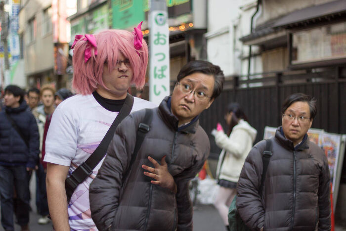 Two men walking on a street with a humorous Photoshop effect creating a duplicated man, showcasing hilarious Photoshop skills.