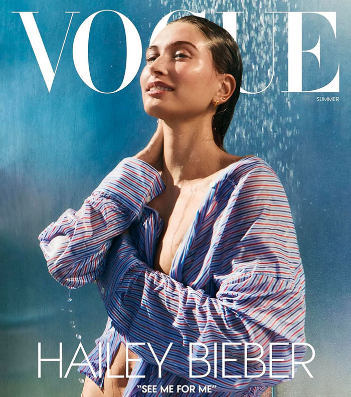 Hailey Bieber on Vogue cover wearing striped shirt, related to Justin Bieber grabbing Hailey&rsquo;s breasts post billionaire news.