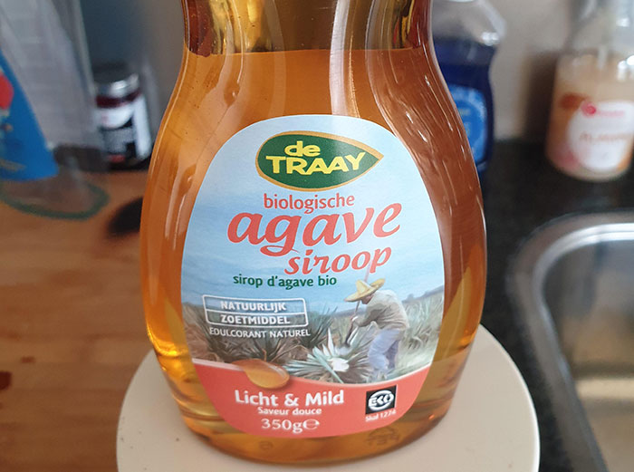 Bottle of agave syrup labeled as a healthy food, one of the healthy foods you might want to skip eating.
