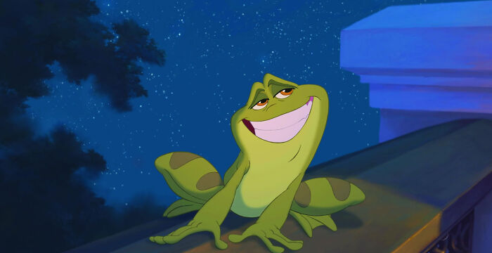 Animated green frog with a sly smile leaning on a balcony at night, illustrating unconventional crushes concept.