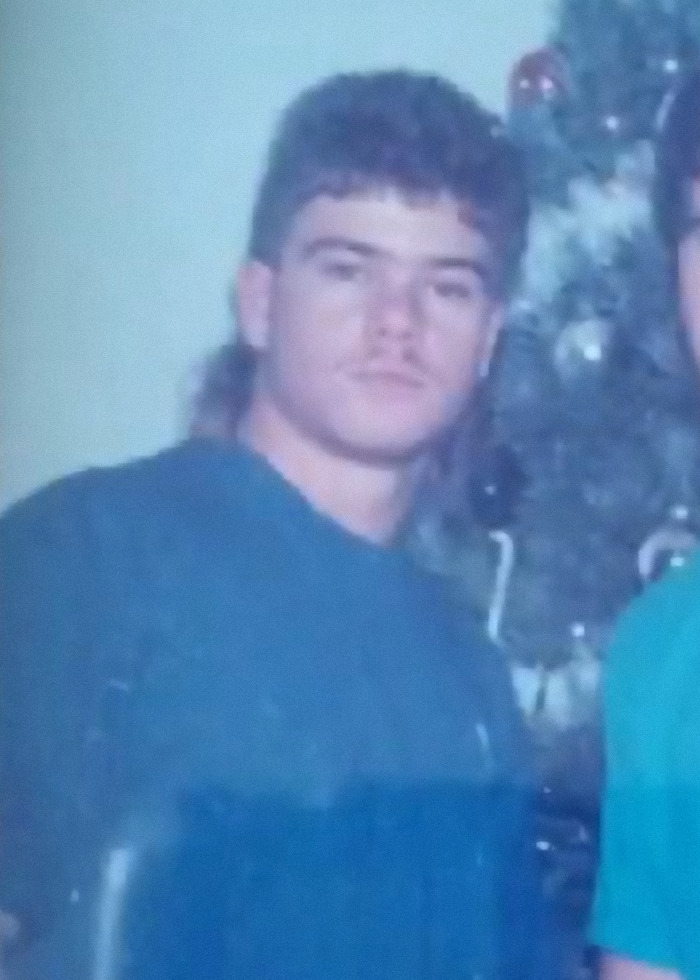 Young man in a blue shirt, pictured near a Christmas tree, related to 10th body found on suspected serial killer&rsquo;s farm.