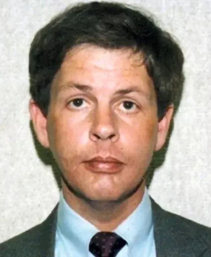 Mugshot of suspected serial killer linked to 10th body found on farm, victim missing since 1993.