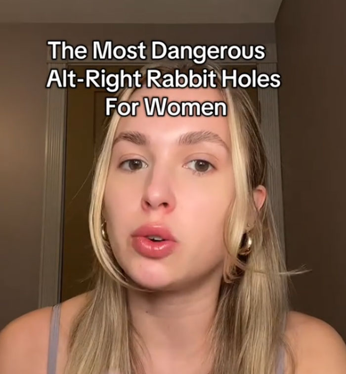 Young woman speaking about the most dangerous alt-right rabbit holes for women in a simple indoor setting.
