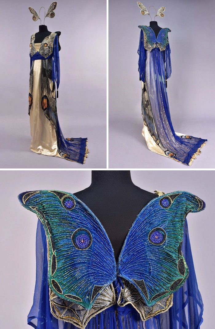 Vintage-inspired butterfly costume dress with blue wings and flowing fabric, showcasing centuries of fashion evolution.