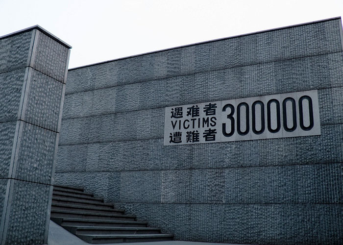 Memorial wall listing 300000 victims, symbolizing historical events that people can't stop researching.