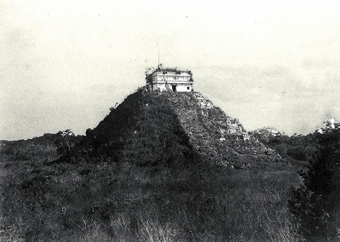 Ancient pyramid structure surrounded by dense forest representing intriguing historical events and archaeological discoveries.